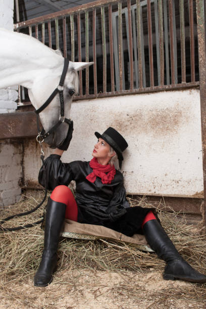 istock young woman embracing horse 888855746