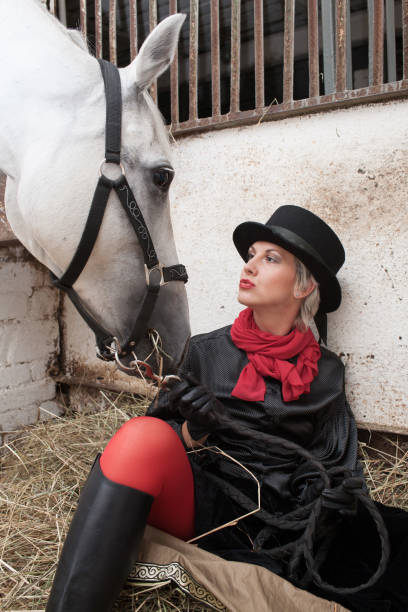 istock young woman embracing horse 888855754