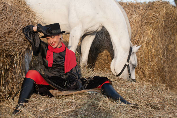istock young woman embracing horse 888855848