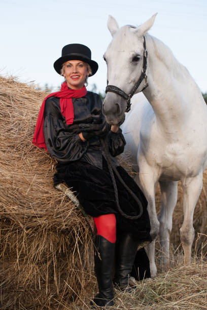 istock young woman embracing horse 888855852