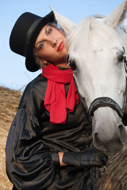 istock young woman embracing horse 888855982
