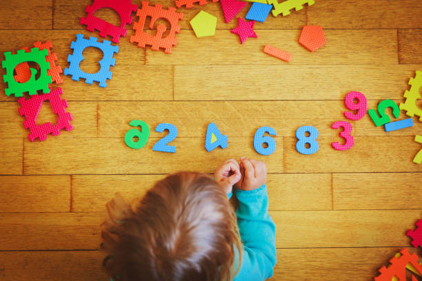 istock little girl learning numbers, education concept 888857010