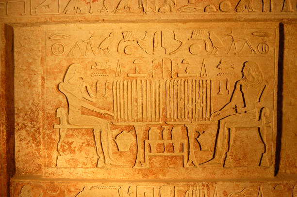 istock Ancient egypt art and hieroglyphs carved on the stone 888857314