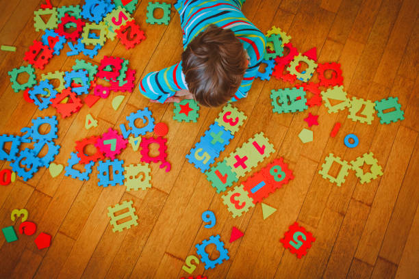 istock little boy learning numbers, education concept 888857326