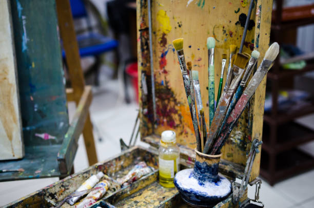 istock Easel with tools in the studio of painting 888866436