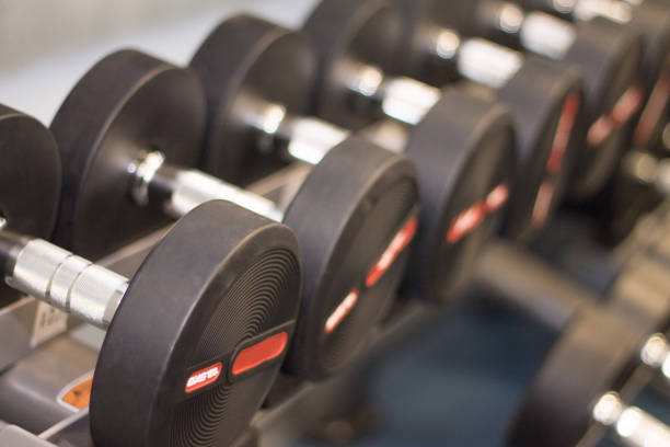 istock Black hand weights in a gym, close-up 888877184