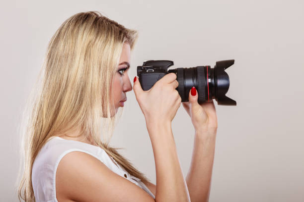 istock Beautiful woman with camera. 888877418