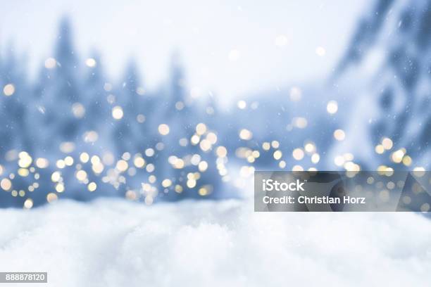 Snowy Winter Christmas Bokeh Background With Circular Lights And Trees Stock Photo - Download Image Now