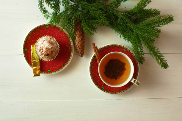 istock winter cup of tea and Christmas decorations 888884476