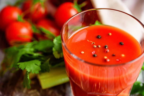 istock Glass of tomato juice with fresh tomatoes 888892922