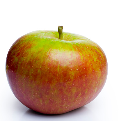 Cox's Orange Pippin, a red and green very tasty apple, isolated on white.