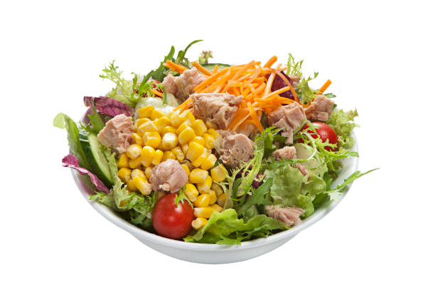 Salad with tuna and fresh vegetables isolated on white background (with clipping path)