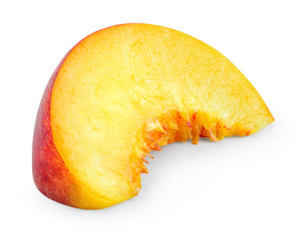 istock Peach. Peach slice isolated on white background. With clipping path. 888907464