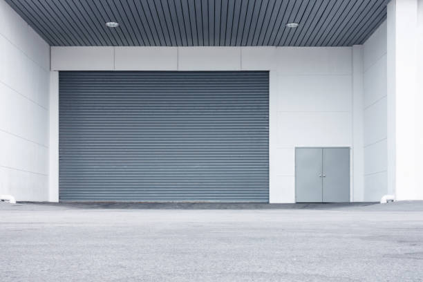 istock Roller shutter door and gate of warehouse materials storage 888920344