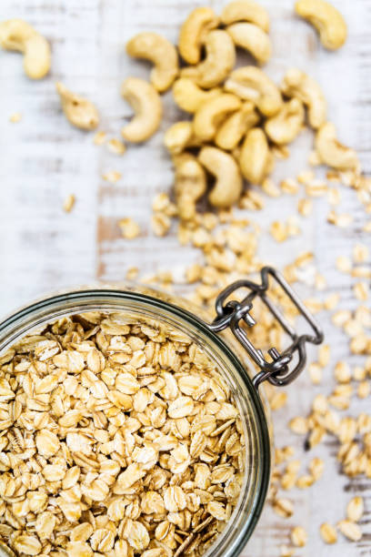 oats in glass jar and cashews stock photo
