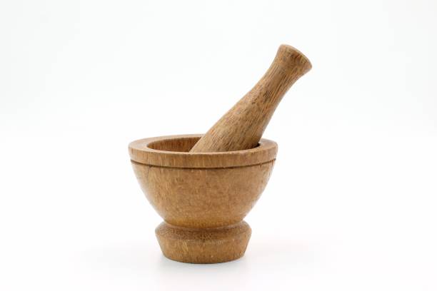 istock Mortar made of wood on white background 888921280