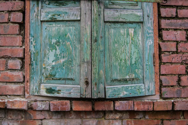 istock Old green wooden shutters closed 888928464