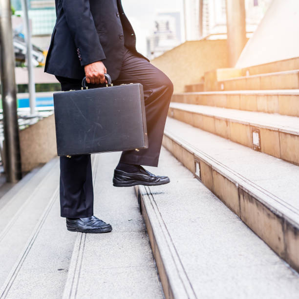 istock Businessman the stairs in a rush hour 888929104