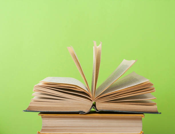 istock Open book, hardback books on wooden table. Education background. Back to school. Copy space for text. 888932014