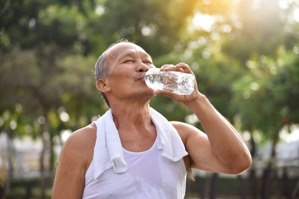 istock Asian senior male drinking water. 888940848