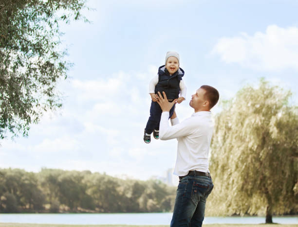 istock Happy father and son on a walk on a Sunny day 888941652