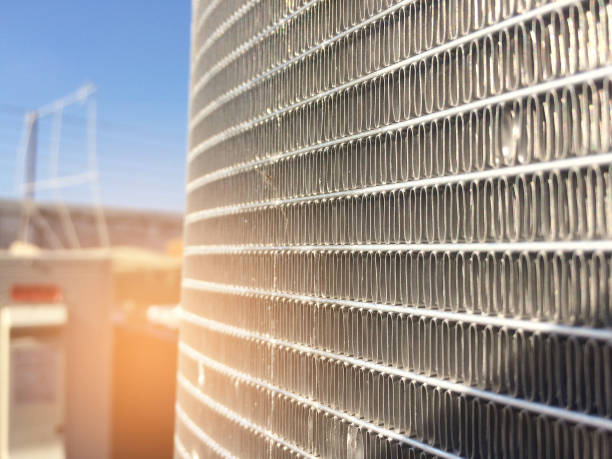 istock Condenser unit used in central air conditioning systems - heat exchanger (heat micro canel) section to cool down and condensate incoming refrigerant vapor into liquid. background texture. technology. 888954266