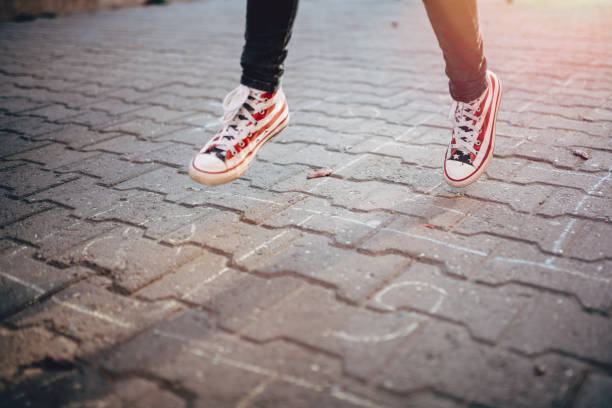 Girl playing Hopscotch in the school playground