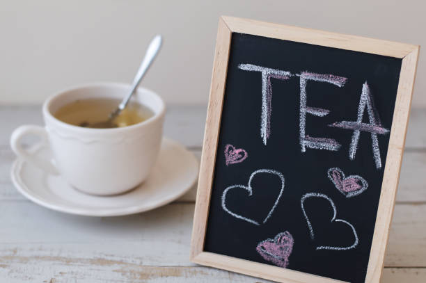 istock Green tea in white cup and blackboard with text 