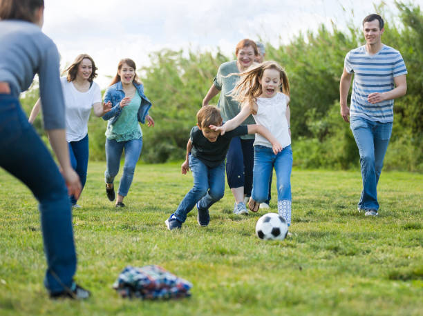 istock people of different ages playing football 888960740