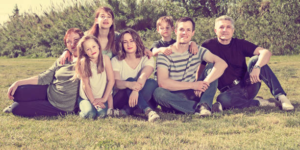 istock Glad people taking photos on the lawn 888960822