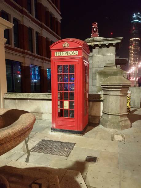 istock Red telephone box at night (London, England) 888968494