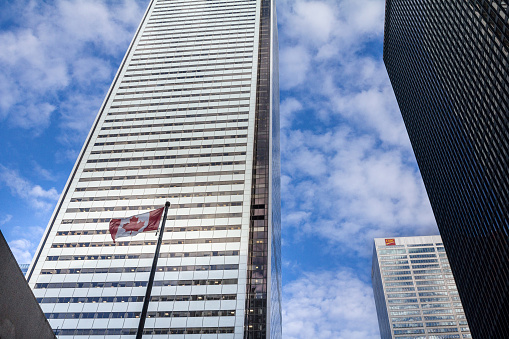 Picture of a CIBC tower in the center of Toronto with the iconic Cn Tower (Also known as Canadian National) in the background. The Canadian Imperial Bank of Commerce, commonly referred to as CIBC, is one of the Big Five banks in Canada. The bank is headquartered in Toronto, Ontario.