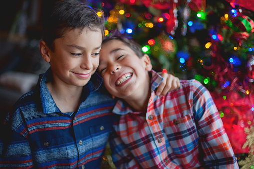 Young brothers interacting with various emotions on a fun family outing in Western Colorado in December boys of mixed race hispanic latin background and caucasian heritage photographed in indoor and outdoor settings with Christmas Decorations in the background (photos professionally retouched - Lightroom / Photoshop - original size 5616 x 3744) http://eyecrave.com/istocklinks/natureearthcreationseasons.jpg