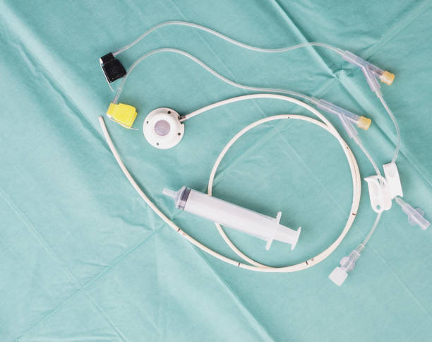 Port a catheter for inserted at chest wall with needle and syringe Port a catheter or central venous port insertion, puncture at chest wall to aorta artery a medical device as silicone cartridges ,has flexible tube with needle and syringe. flushing catheter stock pictures, royalty-free photos & images