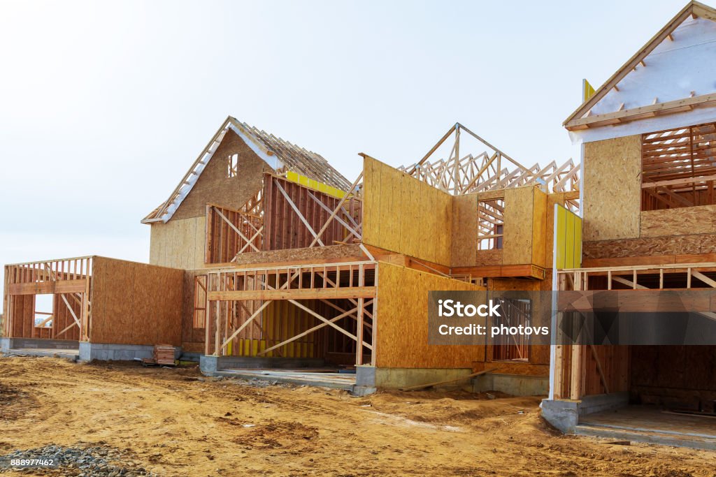 New construction of a house Framed New Construction of a House Building a new house from the ground up New construction of a house Framed New Construction of a House Building a new house wooden frame house construction Construction Industry Stock Photo