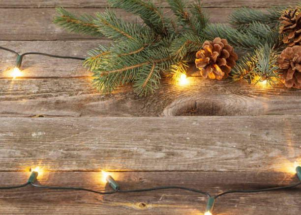 istock Christmas fir branches with cones and garland 888977796