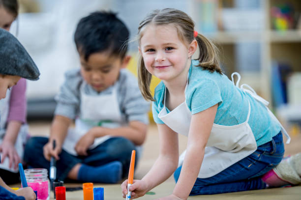 istock Kids Painting Together 888991920
