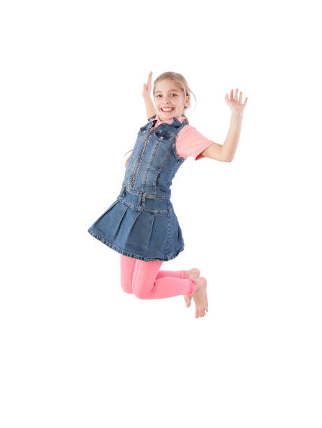 istock young girl jumping 888994308