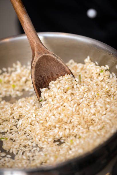 Professional chef preparing meal in private house: Preparing red beet risotto