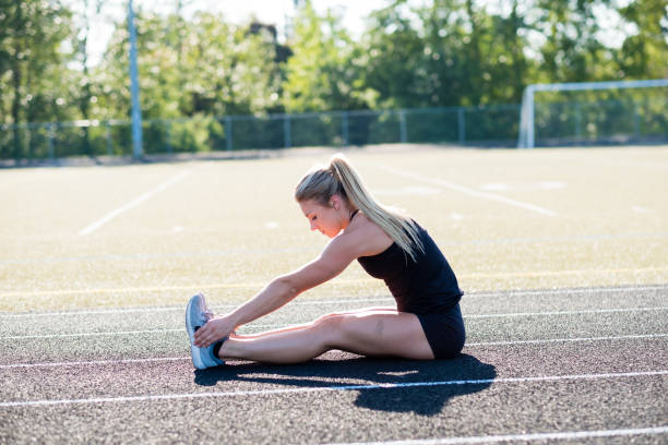 istock Young Female Athlete Working Out on Track 889037210