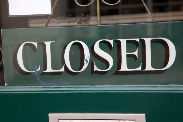 istock Closed Sign on Shop Door 889045434