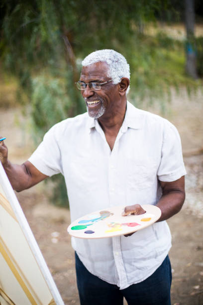 istock Senior African American Man Painting 889045570