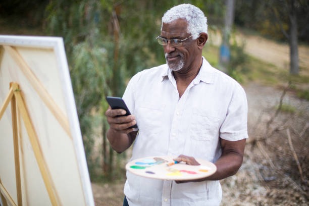 istock Senior African American Man Painting 889045574