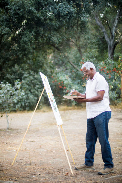istock Senior African American Man Painting 889045658