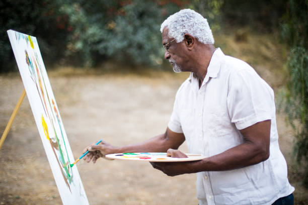 istock Senior African American Man Painting 889045724