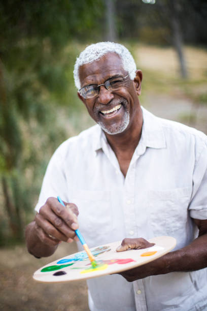 istock Senior African American Man Painting 889045872