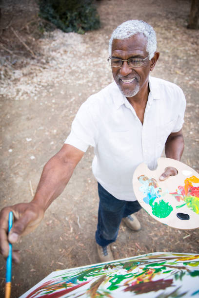 istock A retired black man painting 889046004