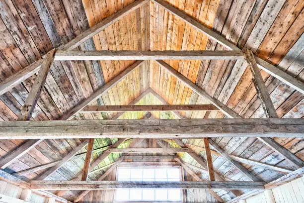 Photo of Vibrant colorful wooden interior of old, abandoned house with window, sunlight sun rays during day