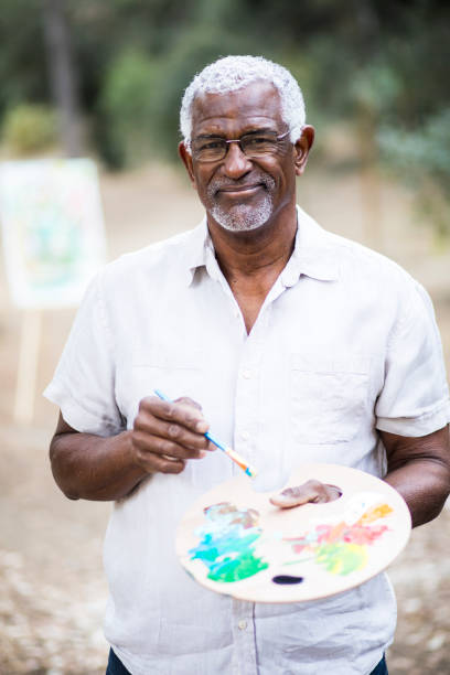 istock A retired black man painting 889046400