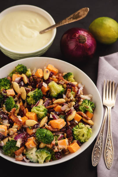 istock Broccoli salad with yogurt dressing, cheese, bacon, almond and cranberries. 889046502